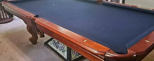 Slate pool table leveled and felted